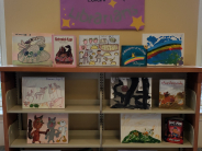 Children's book display with poster