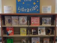 Children's book display with popular books and posters.