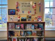 Picture of books and art on display on bookshelves